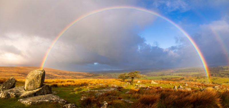 Dartmoor Devon National Park as a rainbow forms over the beautiful park of beauty