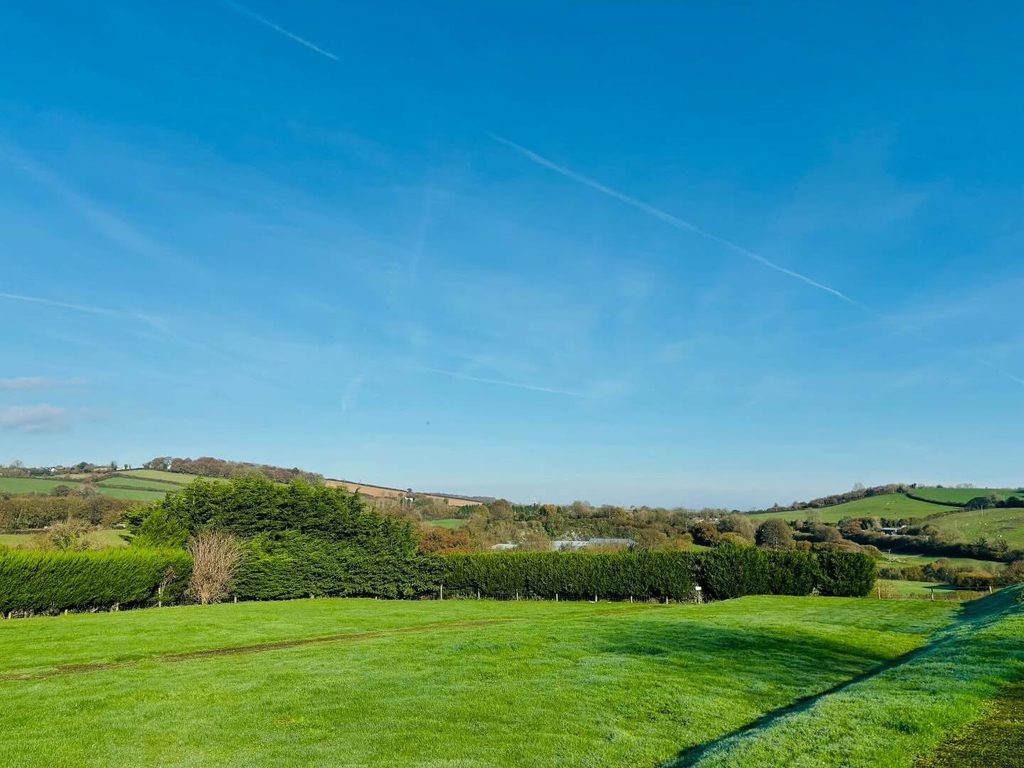 image showing grass pitches for camping and touring in devon camping or touring tent pitches that don't need any electric but can use all facilities at parkers farm devon holiday park